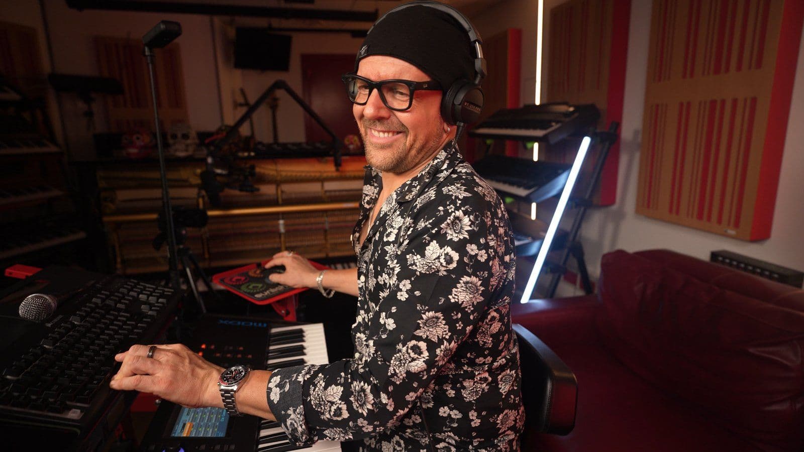 Claudio grinning at the keyboard with headphones on during the Another Brick in the Wall session